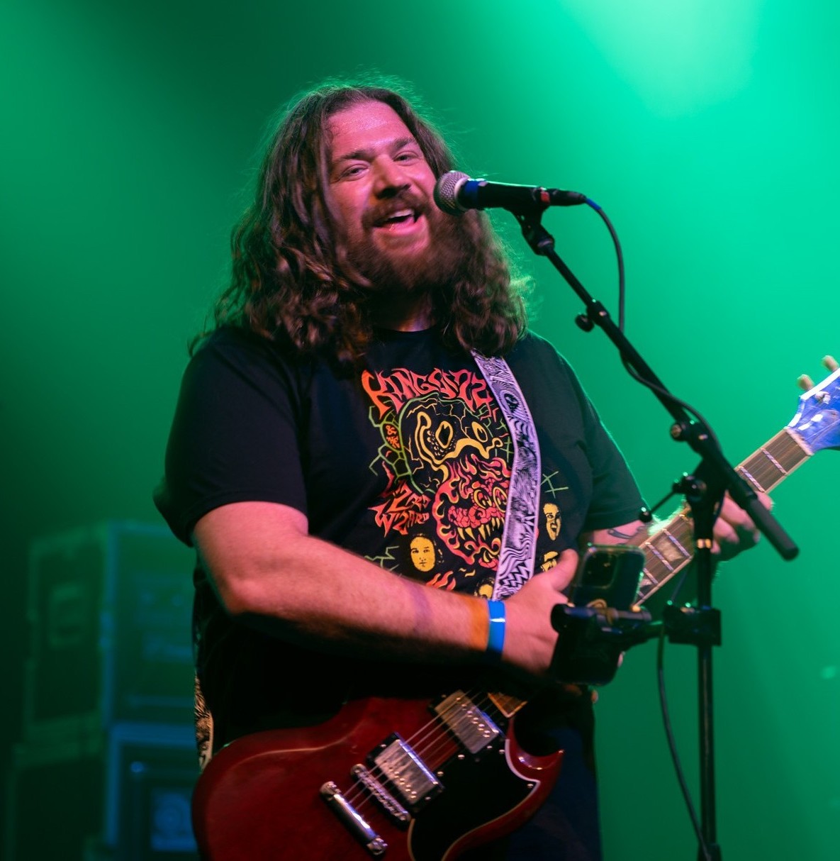Chris Dunn playing guitar and singing