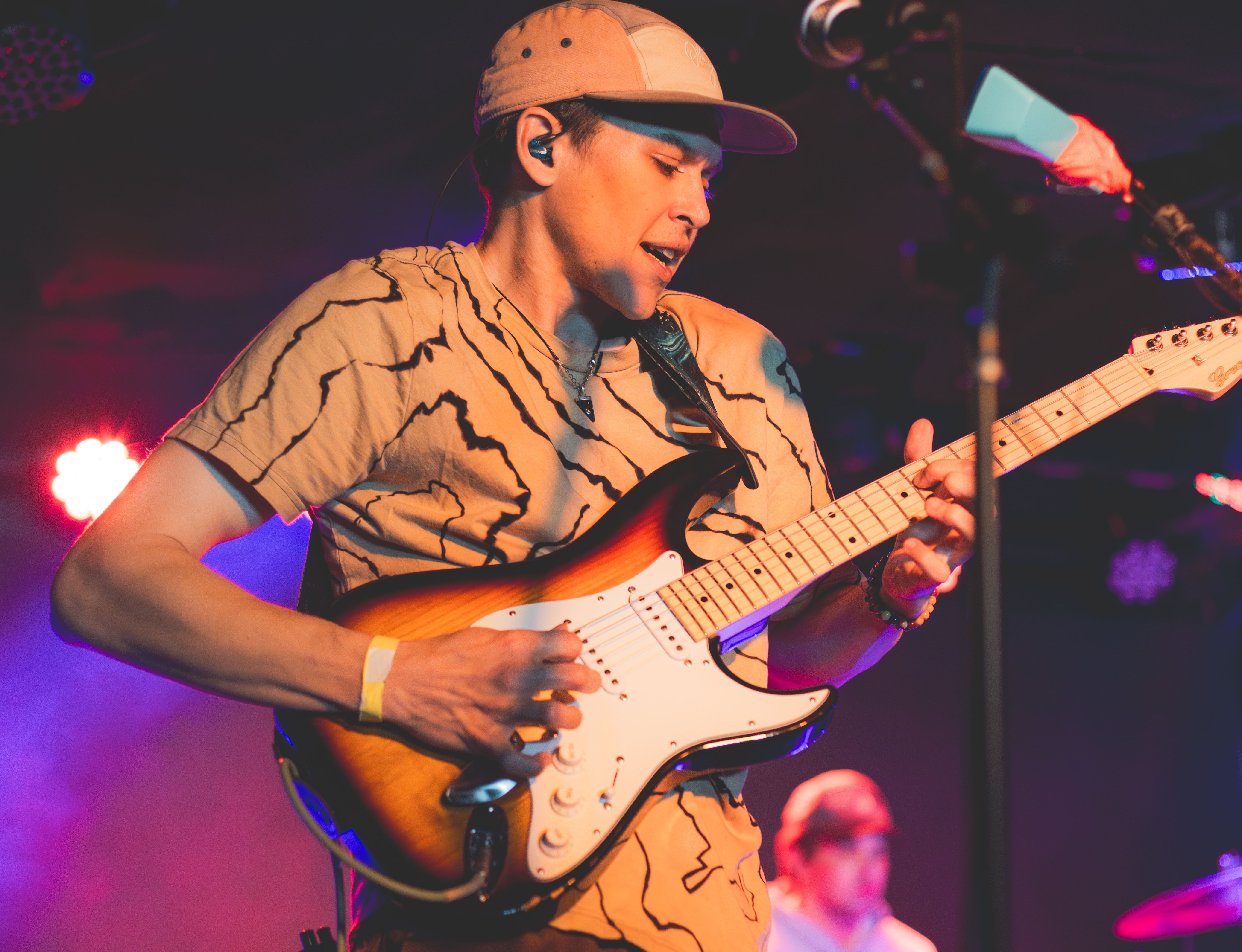 Cory Phillips playing guitar and singing